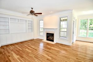 Entertainment - White traditional family room built ins with TV opening and shelves
