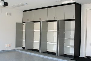 Garage Cabinets - 2 tone black and gray cabinets with white finished interior