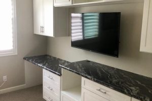 Hobby Room - White built in desk and cabinets with countertop