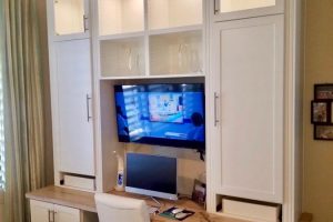 Home Office - White built in desk with wood countertop
