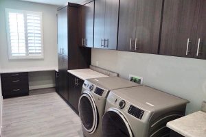 Laundry Room - Multi-use space with built in sink, broom closet and desk