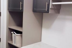 Laundry Room - Two tone gray folding table with drying rod and hamper cubbies