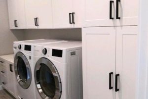 Laundry Room - White shaker cabinets with black modern handles