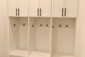 Mudroom and Seating -White built in lockers for shoes, backpacks, and jackets