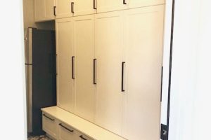 Mudroom and Seating - White lockers with doors and drawers makes space for everyone_s belongings