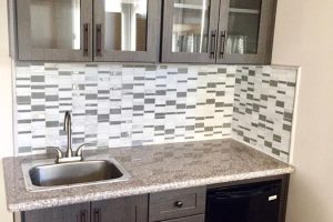 Pantry & Bar - Wet bar with mini fridge, sink and glass cabinet doors