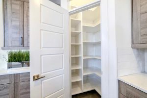 Pantry & Bar - Small pantry with empty wall shelves at the corner of the kitchen of home