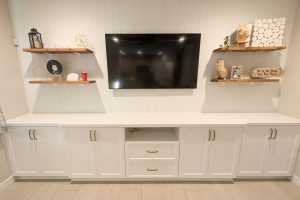 White Entertainment Center with Shiplap and Floating Shelves